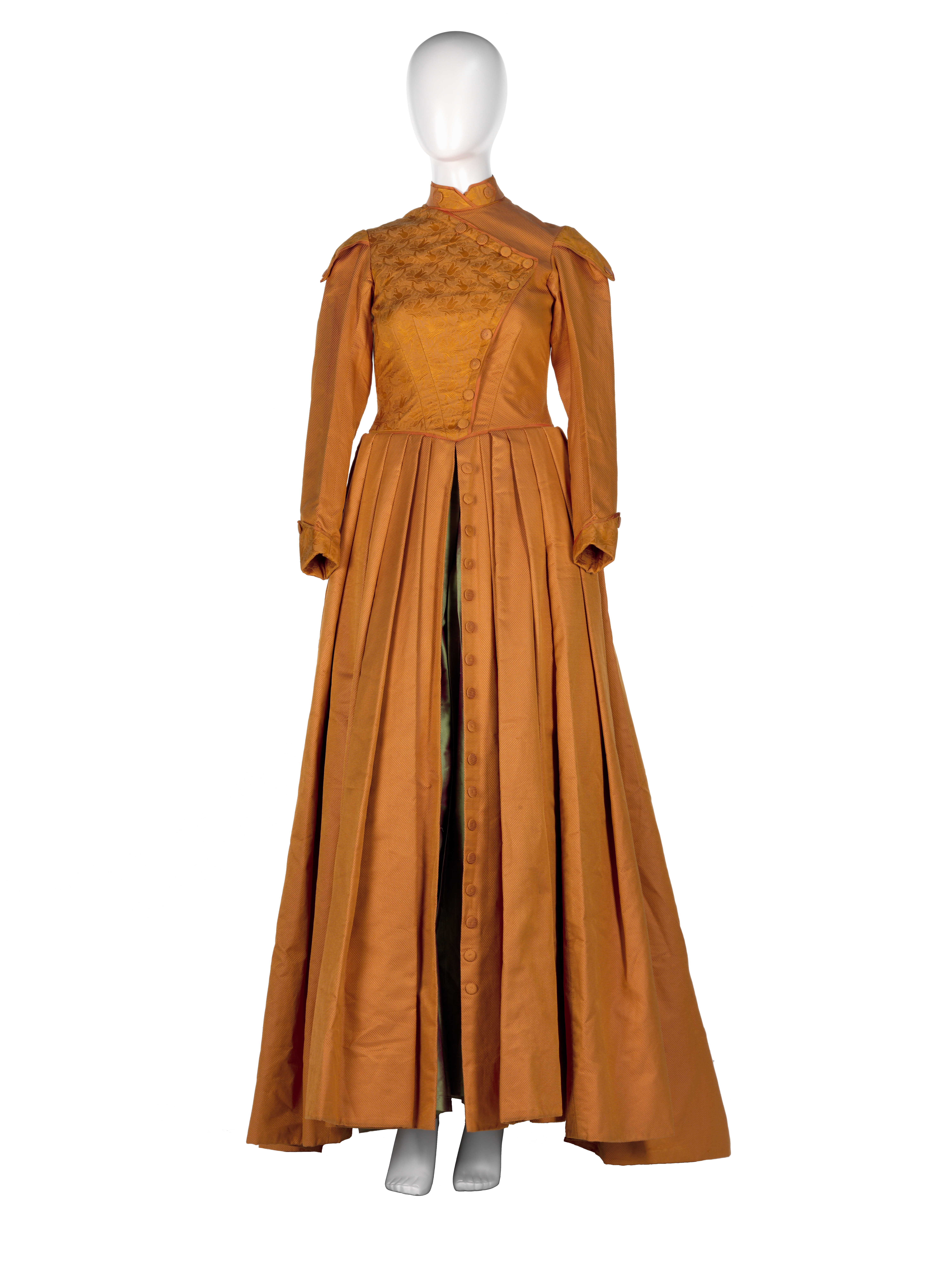 Orange coloured full-length coat on a mannequin