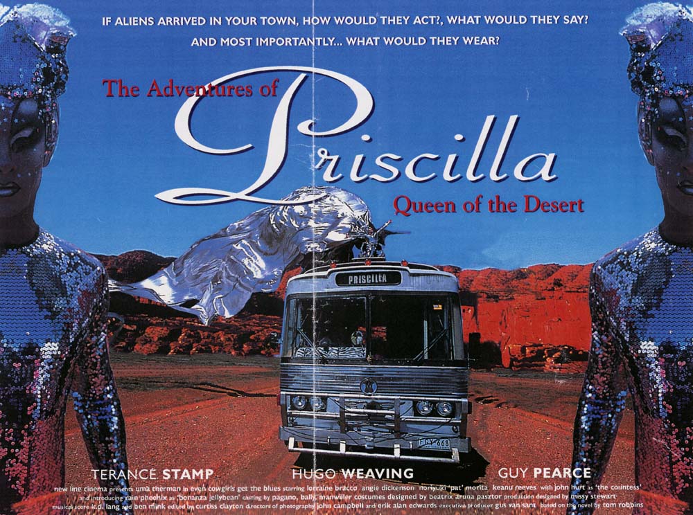 Image of bus travelling in desert setting with a drag queen riding on top dressed in a silver, flowing costume. Image is bordered by two drag queens dressed in silver sequined costumes and headresses.