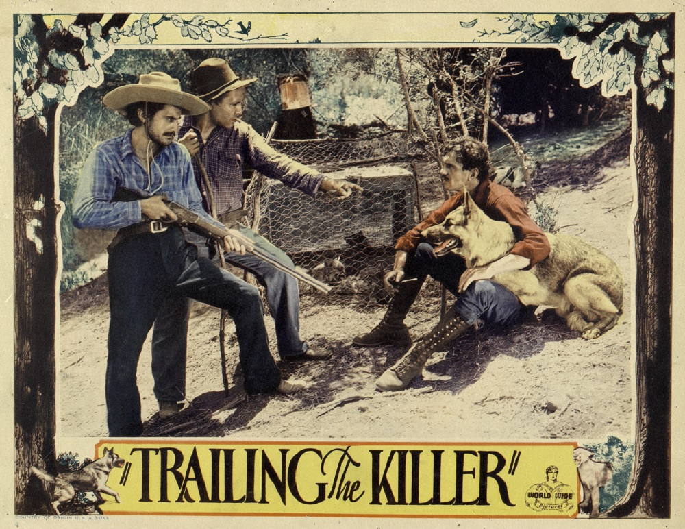 Central images features the alsation Caesar resting on the lap of Francis McDonald with two men standing, one holding a gun.