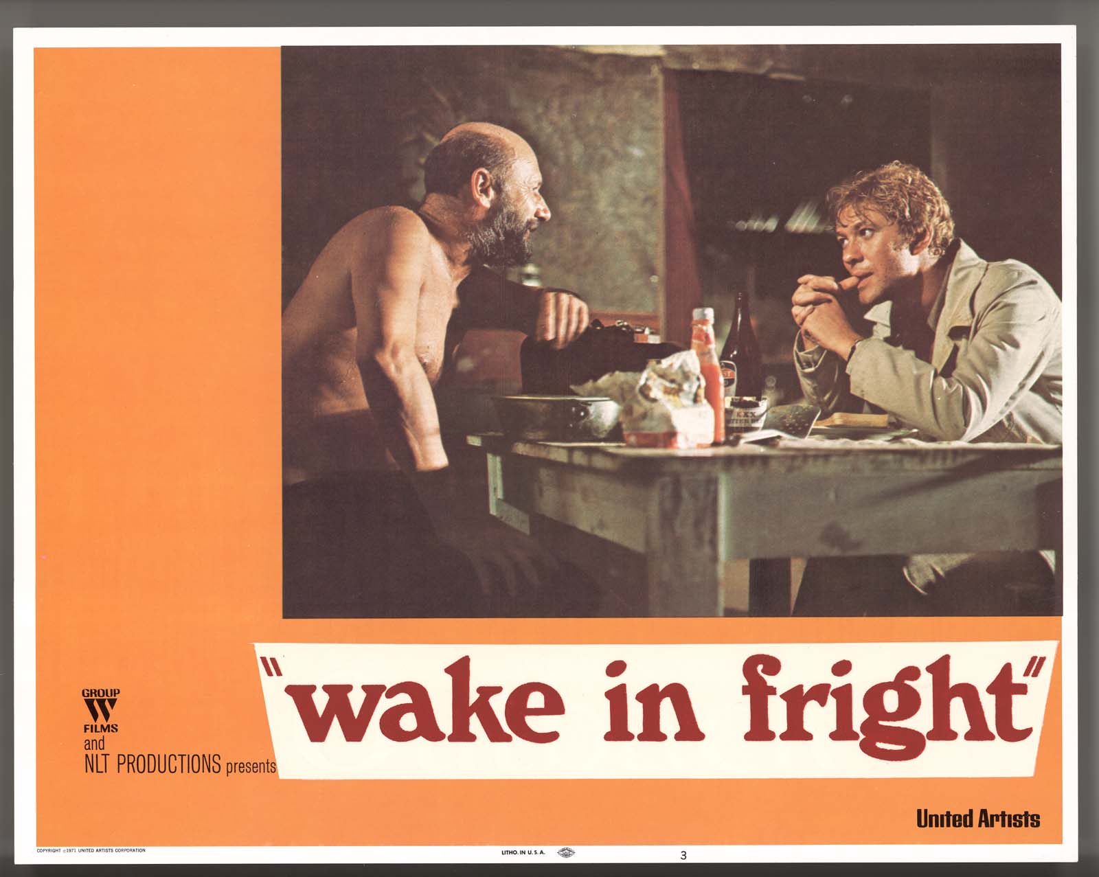 Wake in Fright film lobby card featuring a photo of Donald Pleasence and Gary Bond seated at a table in Doc
