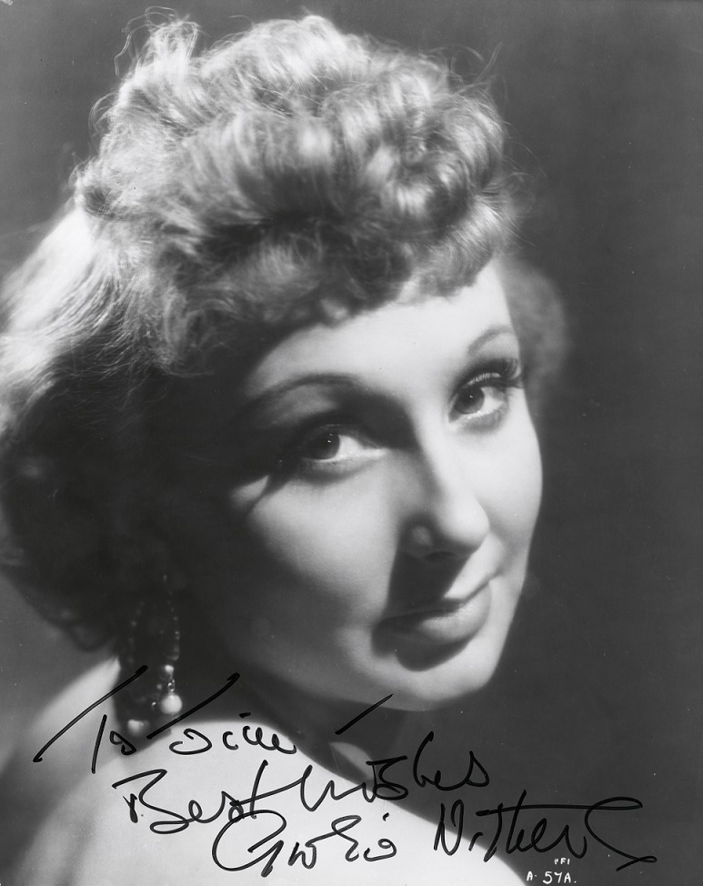 Studio portrait of Googie Withers. Autographed in black texta 