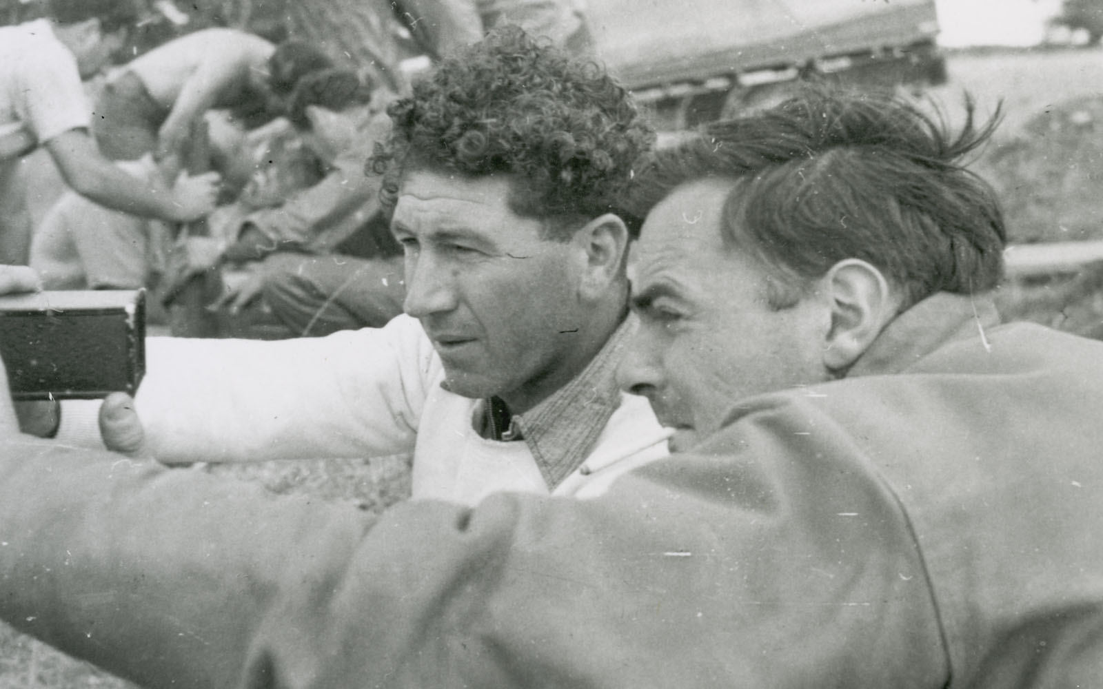 Cinematographer Ross Wood and director Cecil Holmes looking through a camera viewfinder on location for the filming of Captain Thunderbolt in 1951