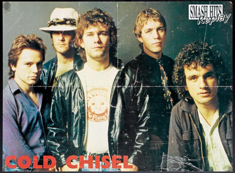 Cold Chisel Smash Hits poster Poster with 'Cold Chisel' in red block letters at bottom left and the magazine name 'Smash Hits Replay' top right. Cold Chisel band members are pictured against a dark background. L to R: Phil Small, Don Walker, Jimmy Barnes, Steve Prestwich and Ian Moss.