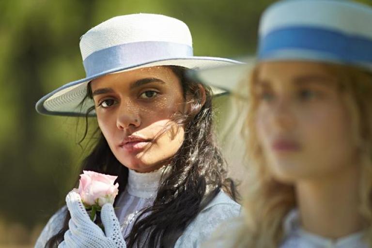 Marion and Irma wearing white straw hats and gloves