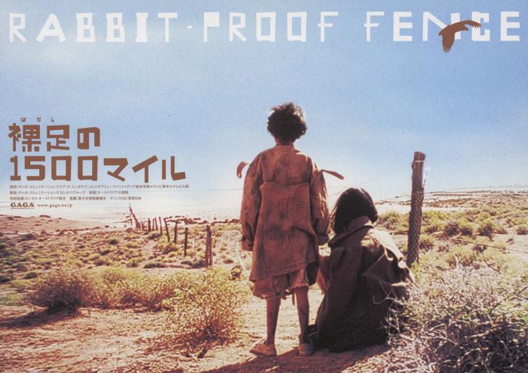 A Japenese advertising flyer for Rabbit-Proof Fence with a still of two girls sitting by the fence gazing into the desert.