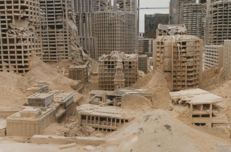 Close up of a model set of buildings created for the set of post-apocalyptic Sydney in Mad Max Beyond Thunderdome. The clock tower of the General Post Office in Martin Place is recognisable amongst the rubble.