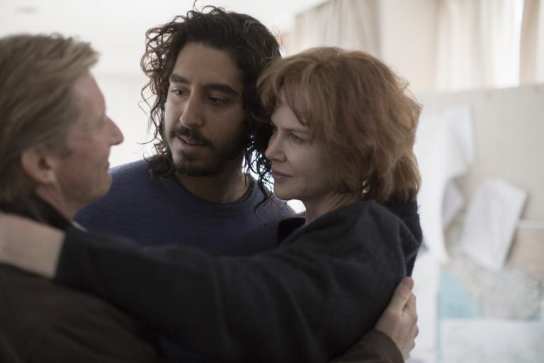 David Wenham, Dev Patel and Nicole Kidman embracing and looking at each other