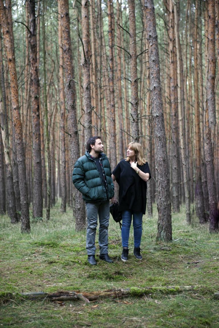 Cate Shortland on the set of Berlin Syndrome Director Cate Shortland works with actor Max Rielmelt in a forest location in Germany.
