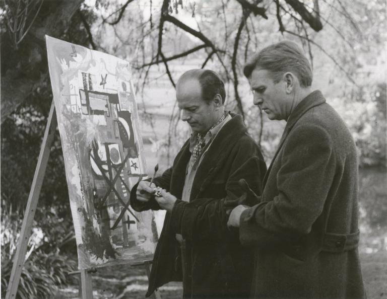 Norman Kaye and Leonard Teale standing outdoors at an easel in an episode of Homicide