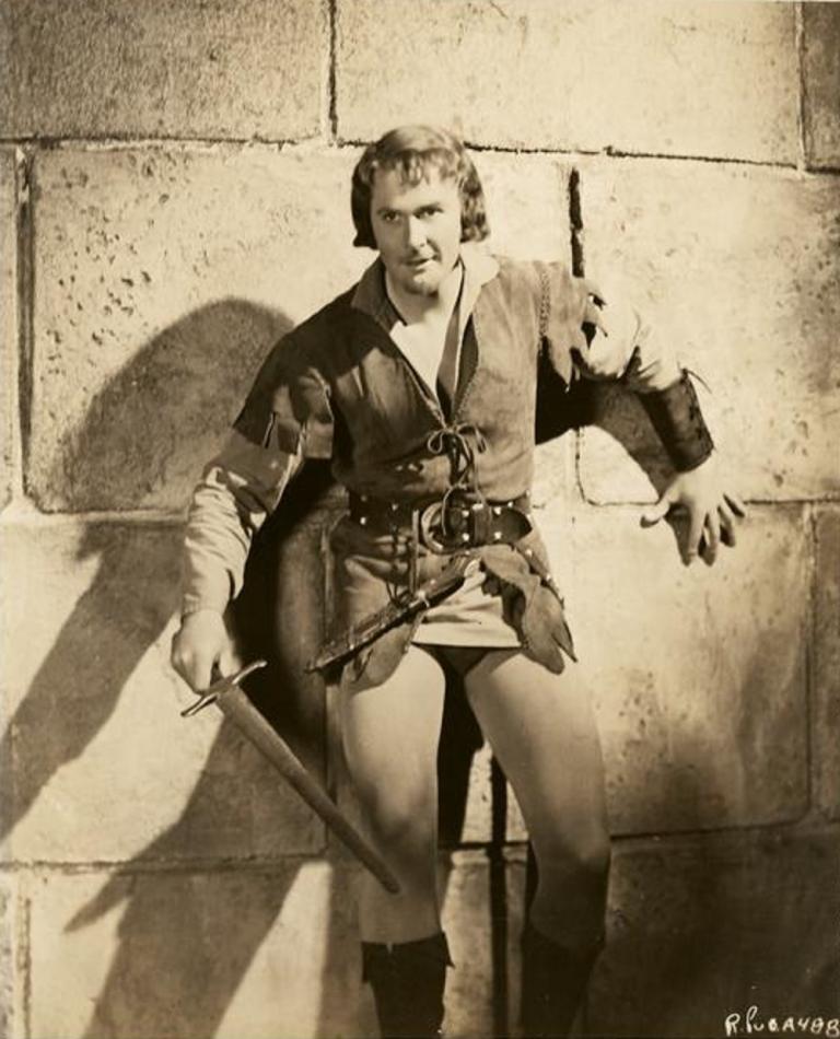 Errol Flynn with sword drawn