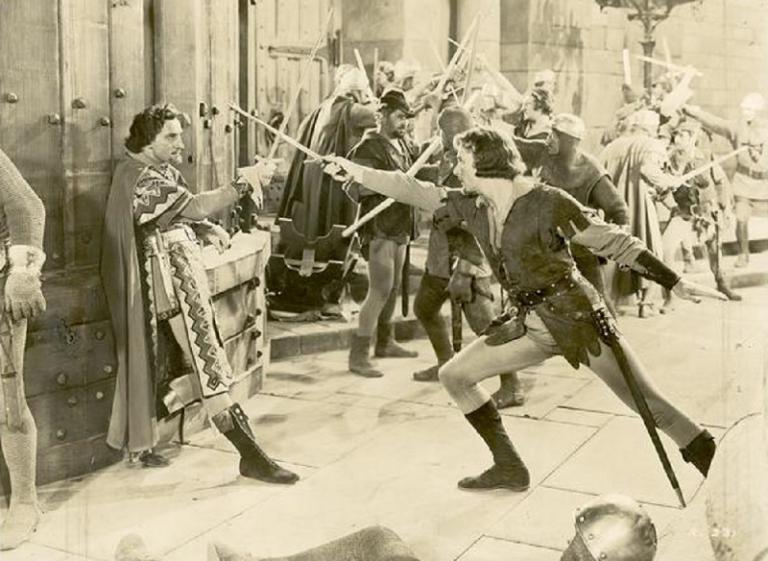 Errol Flynn sword fights Basil Rathbone