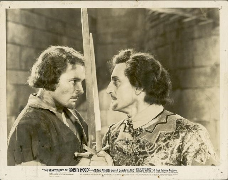 Errol Flynn glares at Basil Rathbone