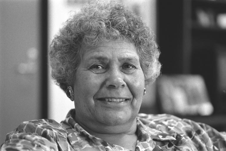Australian Biography: Lowitja O'Donoghue Head and shoulders portrait of Indigenous activist Lois O'Donoghue, smiling directly at camera.
