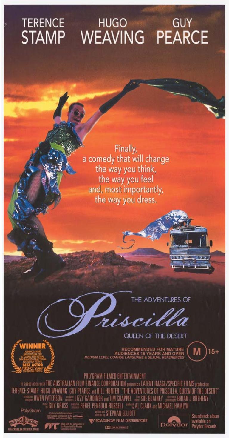  Main image has orange background colour and depicts Male in female drag. Text reads: 'Finally, a comedy that will change the way you think, the way you feel and, most importantly, the way you dress'.