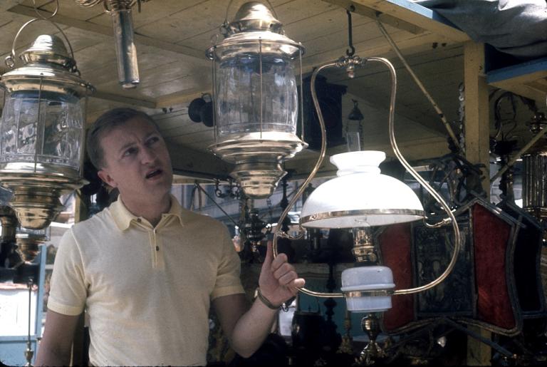 Graham Kennedy examines a lantern in a shop in Rome, Italy