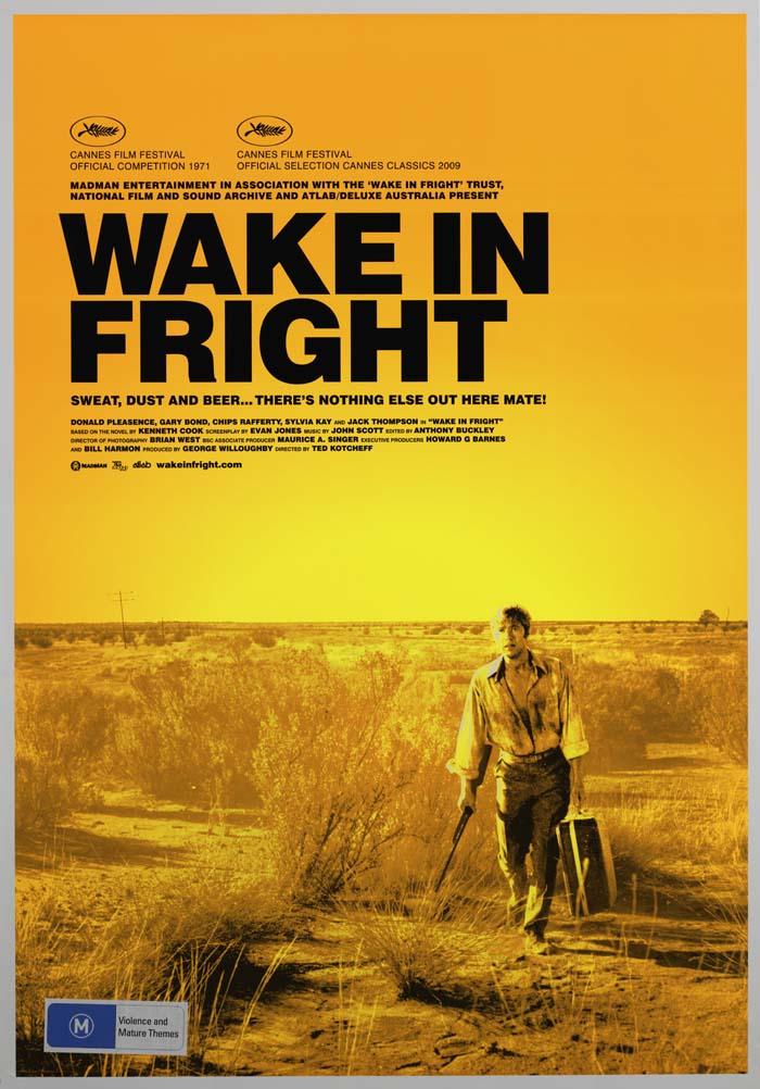 Australian poster: Wake in Fright Film still in yellow tones with a man walking in a barren landscape carrying a suitcase and a rifle. Title in large black letters.