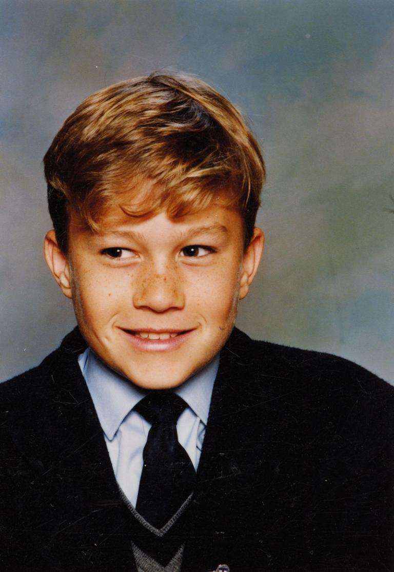 Portrait of Heath Ledger as a boy wearing school uniform.
