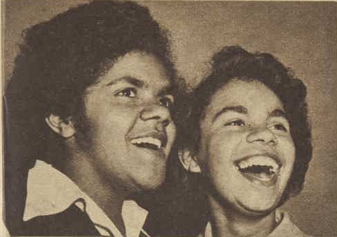Sepia photo of two young Indigenous women singing. Sepia photo of two young Indigenous women singing.