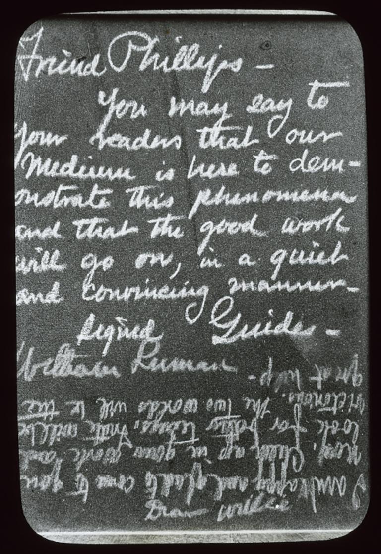 Glass slide of spirit writing Black and white glass slide showing two different styles of writing of words from spirits.