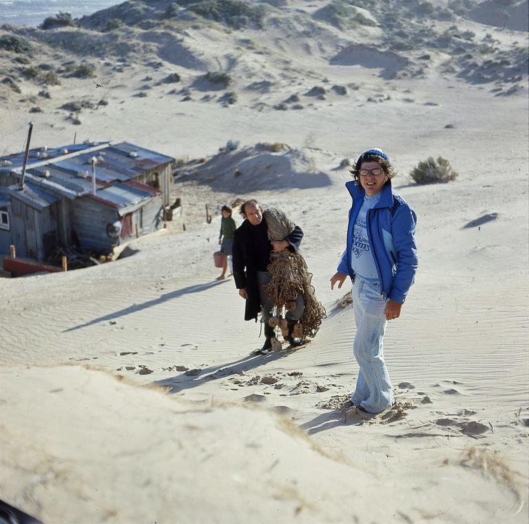 Storm Boy - Henri Safran and Peter Cummins Director Henri Safran standing in the sand dunes with actor Peter Cummins (Hide-Away Tom) above the humpy set from Storm Boy