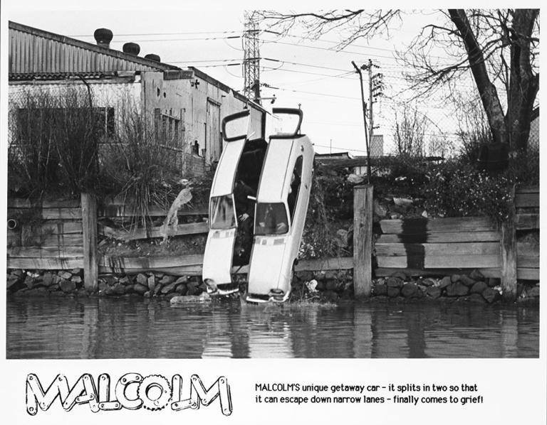 The two halves of Malcolm's getaway car plunge into a river The two halves of Malcolm's getaway car plunge into a river