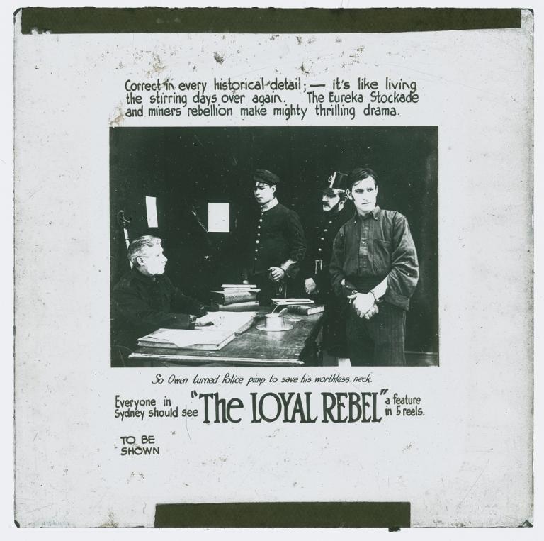 Glass theatre slide for the filmThe Loyal Rebel shows a handcuffed Eureka Stockade rebel with police men.