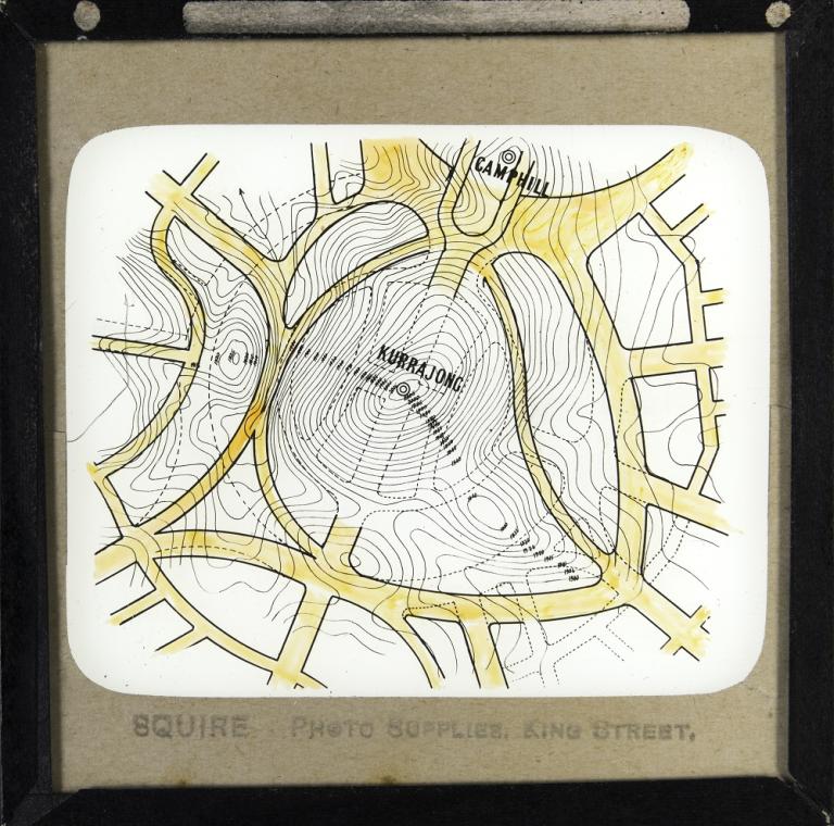 Glass slide showing an alternative design proposed by Walter Scott Griffiths for Kurrajong Hill. Griffith's plan is overlaid onto Walter Burley Griffin's plan for the Hill Glass slide showing an alternative design proposed by Walter Scott Griffiths for Kurrajong Hill. Griffith's plan is overlaid onto Walter Burley Griffin's plan for the Hill