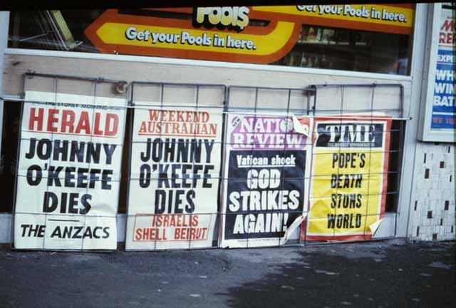 Newspaper billboards announcing death of Johnny O'Keefe and Pope John Paul I
