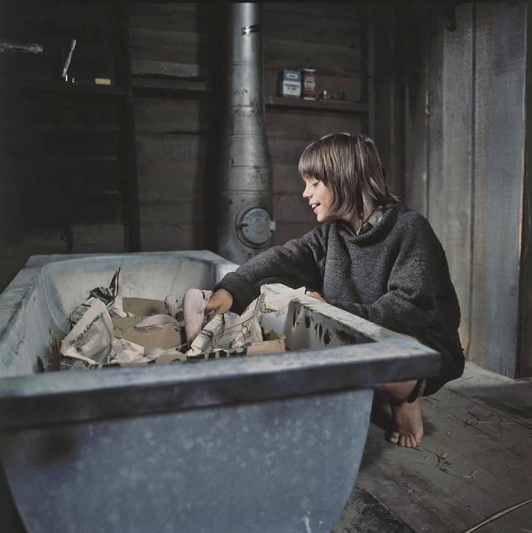 Storm Boy - Greg Rowe and baby pelicans Greg Rowe as Storm Boy looking after baby pelicans who are sitting in an old bath tub in a scene from Storm Boy