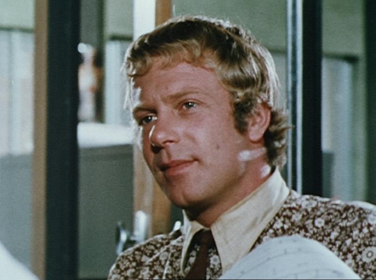 Jack Thompson in an office, wearing a tie