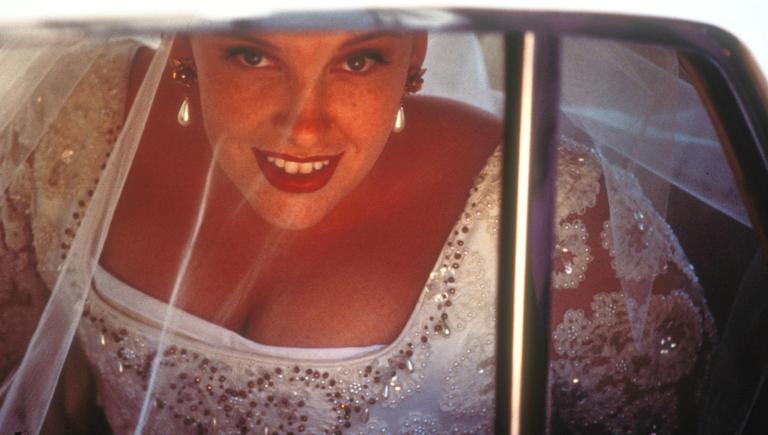Muriel arrives at her wedding Muriel (Toni Collette) smiling out the car window as she arrives at her wedding