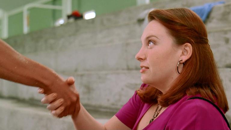 Muriel (Toni Collette) shaking David's (Daniel Lapaine, unseen) hand