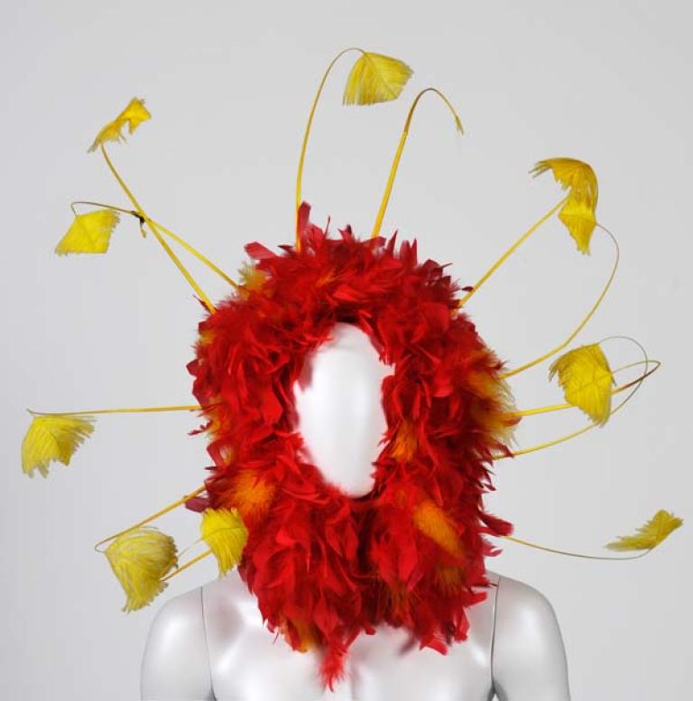 Red and yellow headpiece Red and yellow feathered headpiece from 'The Adventures of Priscilla, Queen of the Desert'.