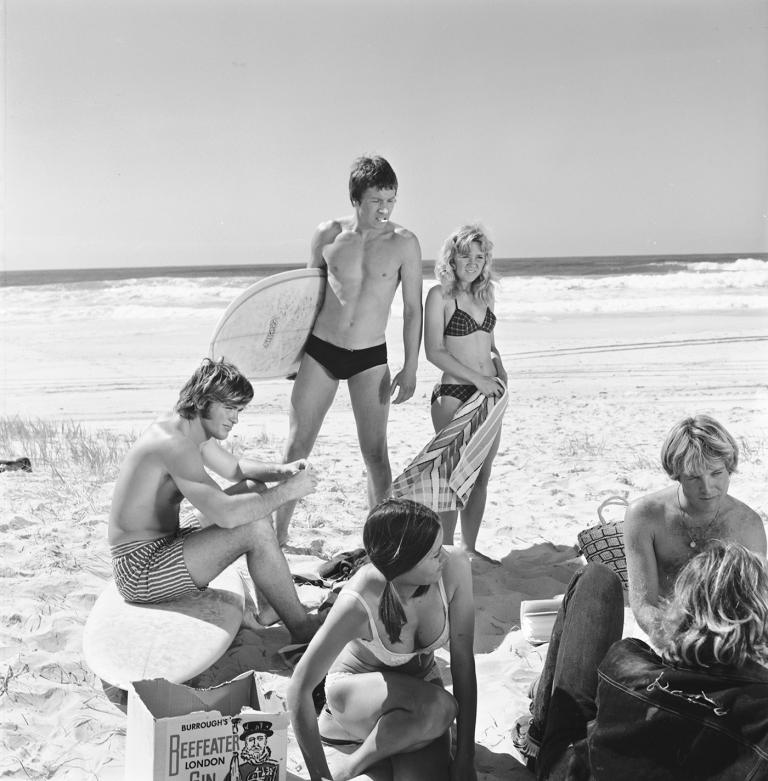 Still from the film Where Are We Heading shows six young people standing on a beach