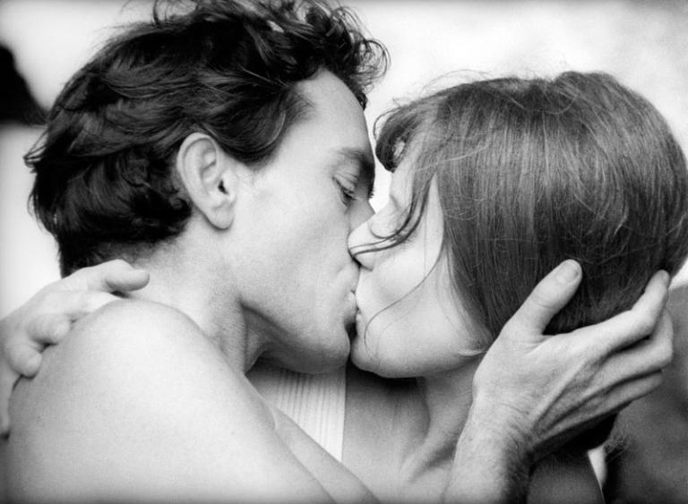 Mark McManus and Jeanie Drynan in 2000 Weeks Mark McManus as Will and Jeanie Drynan as Jacky kiss in a full close-up.