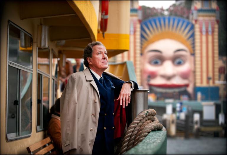Geoffrey Rush as Basil Hunter on a ferry approaching Luna Park in Sydney.