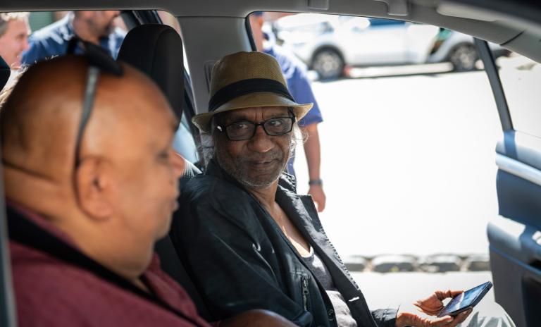 Kutcha Edwards with Bart Willoughby Kutcha Edwards and Bart Willoughby seated in the front of a car.