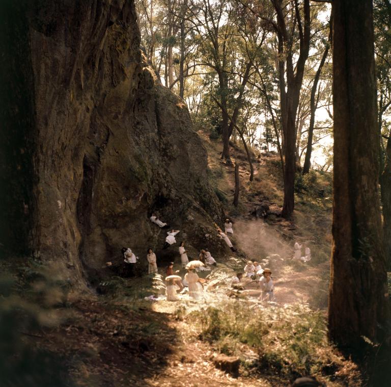 Production photo of the picnic scene at the rock