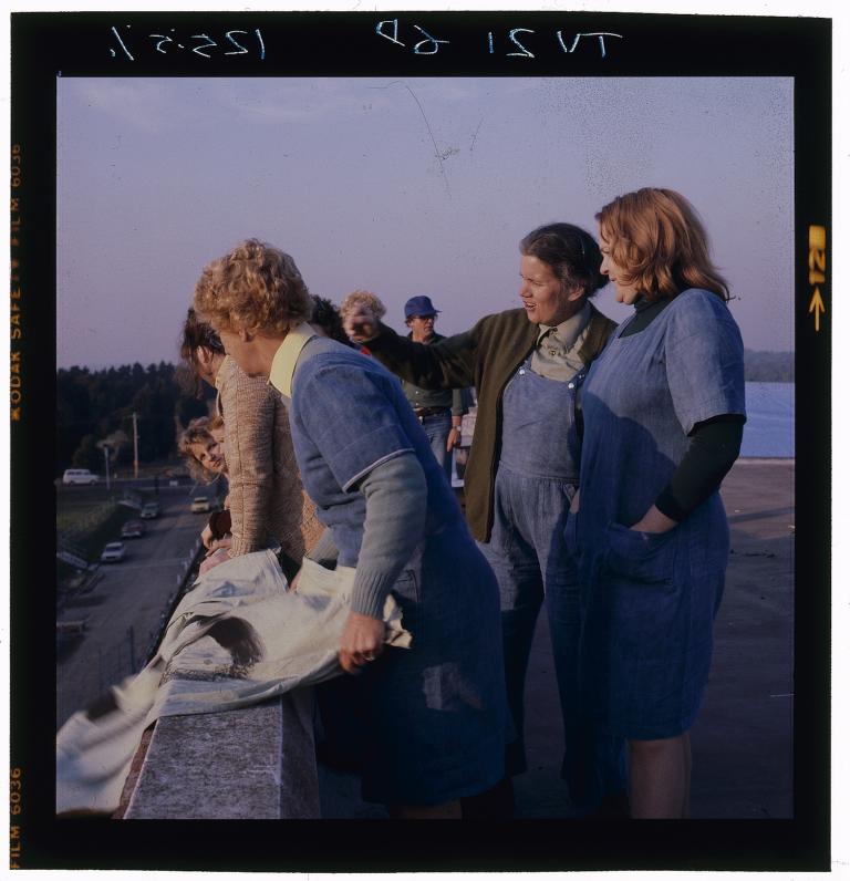 Judy and Bea rehearsing - Prisoner behind the scenes Actresses Betty Bobbitt and Val Lehman rehearsing the rooftop protest scene. An extra is holding a sign, leaning slightly over the ledge.