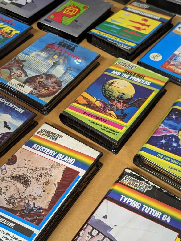 Rows of video game covers laid out on a table. 