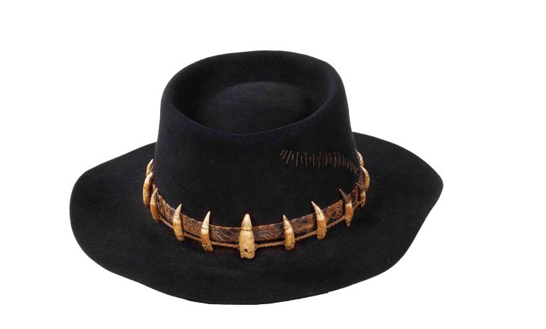 a black hat with crocodile teeth