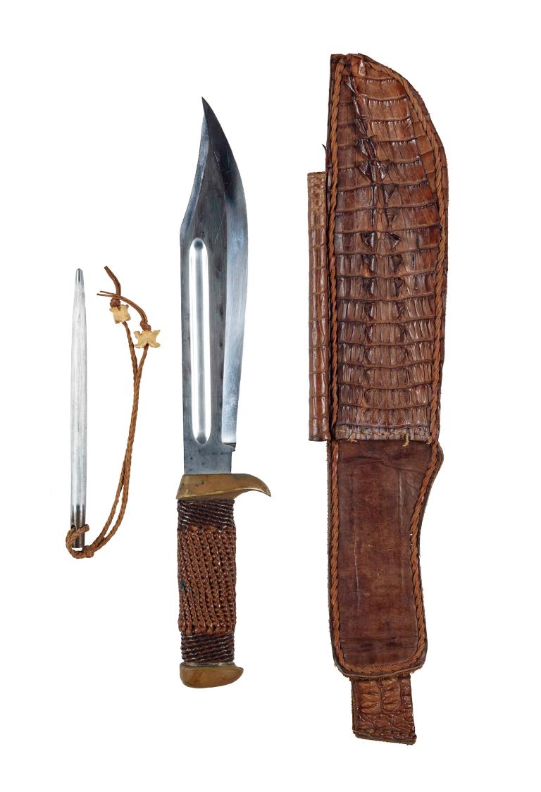 two knives decorated in crocodile skin
