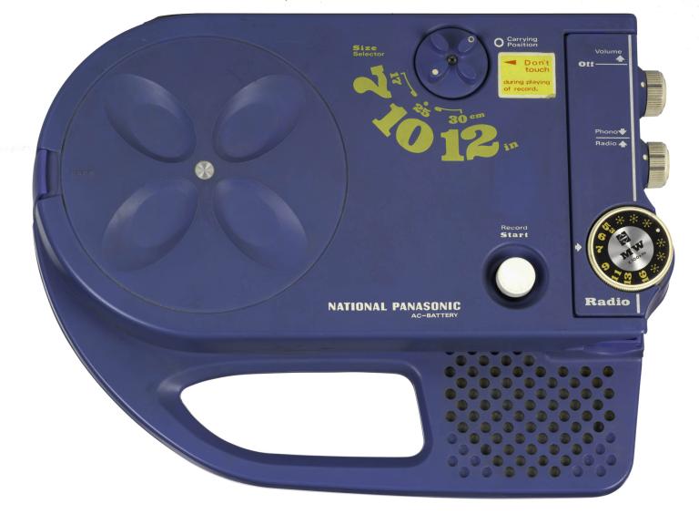 A photo of a blue radio with dials on the side and a handle below. 