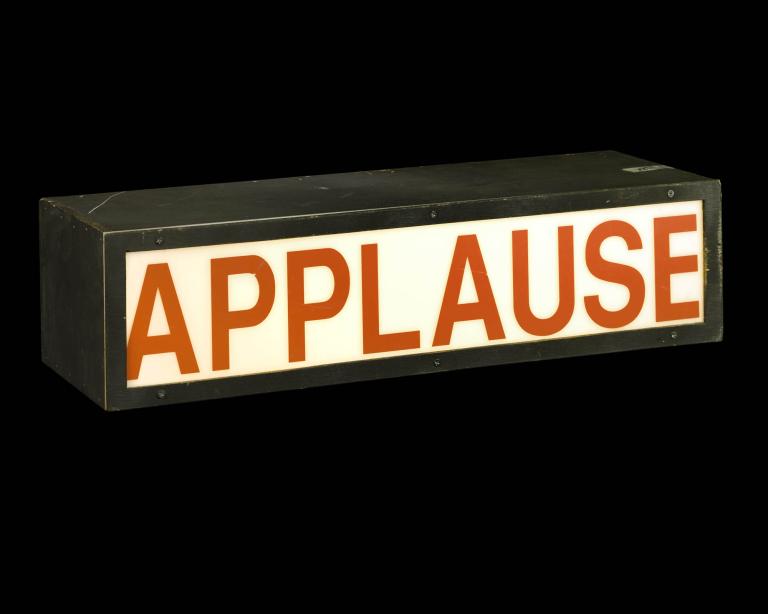 A photo of an Applause sign used in TV Studios.