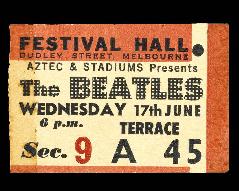 A photo of a ticket stub for the Beatles concert in 1964.
