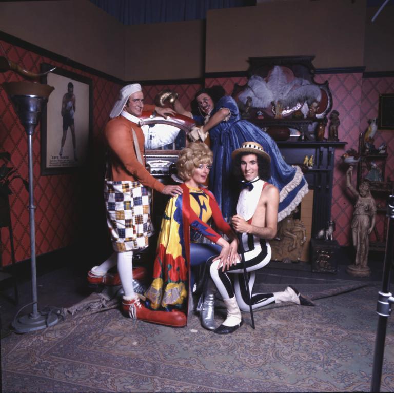 Rory O'Donoghue, Garry McDonald, Sandra McGregor, and Grahame Bond pose in costume in this humorous photo.