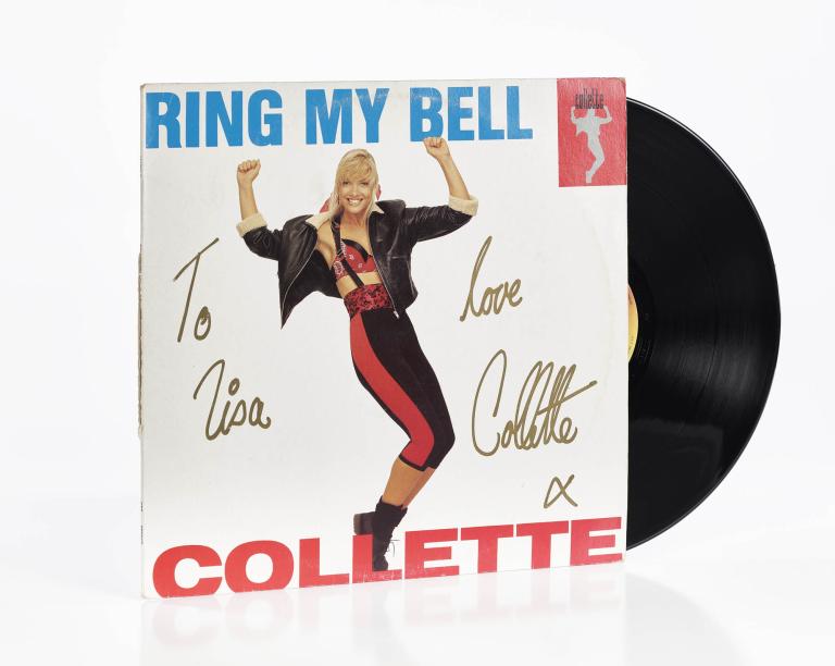 Autographed cover of the single 'Ring My Bell' by Collette, featuring her dancing pose with a vinyl record