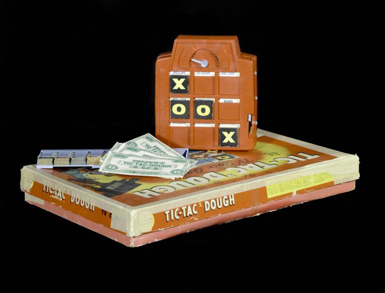Vintage 1960s Tic Tac Dough game set with board, money, and game pieces