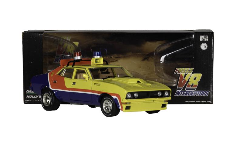 Limited edition model car from Mad Max Beyond Thunderdome featuring vibrant multicolors and roof sirens, displayed in packaging