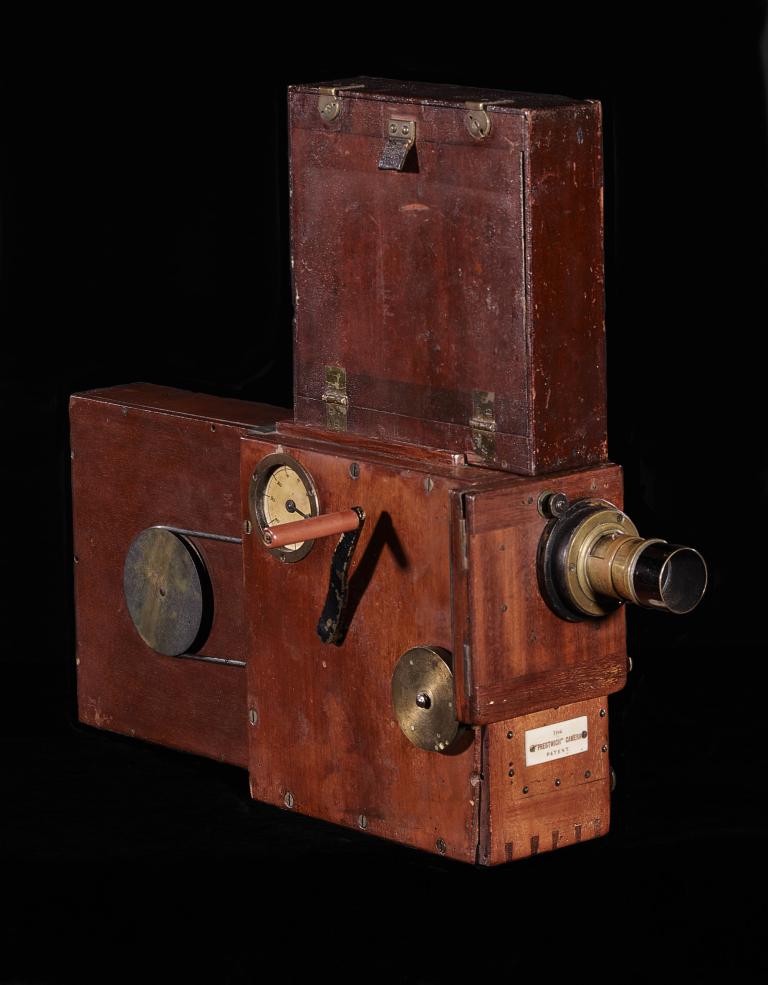 Prestwich cine camera with a hand crank and wooden casing